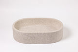 Oval marble vessel sink made from natural stone, modern countertop bathroom sink