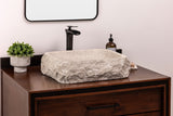 Rustic rectangular natural stone vessel bathroom sink made of light beige-gray marble with a chiseled farmhouse-style exterior.
