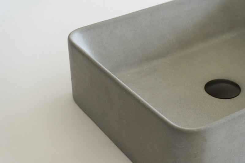 Rectangular concrete vessel sink made from GFRC with smooth finish – modern bathroom washbasin
