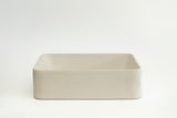 Rectangular concrete vessel sink made from GFRC with smooth finish – modern bathroom washbasin