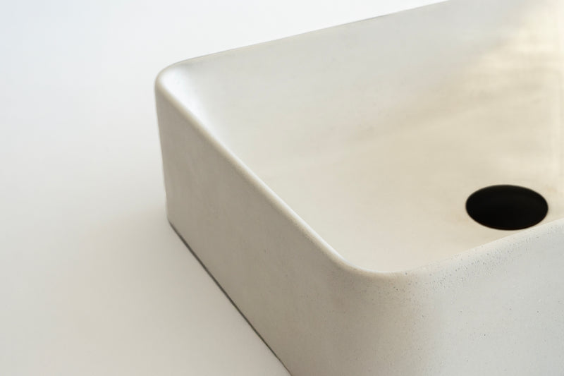 Rectangular concrete vessel sink made from GFRC with smooth finish – modern bathroom washbasin