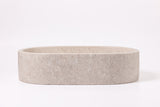 Oval marble vessel sink made from natural stone, modern countertop bathroom sink