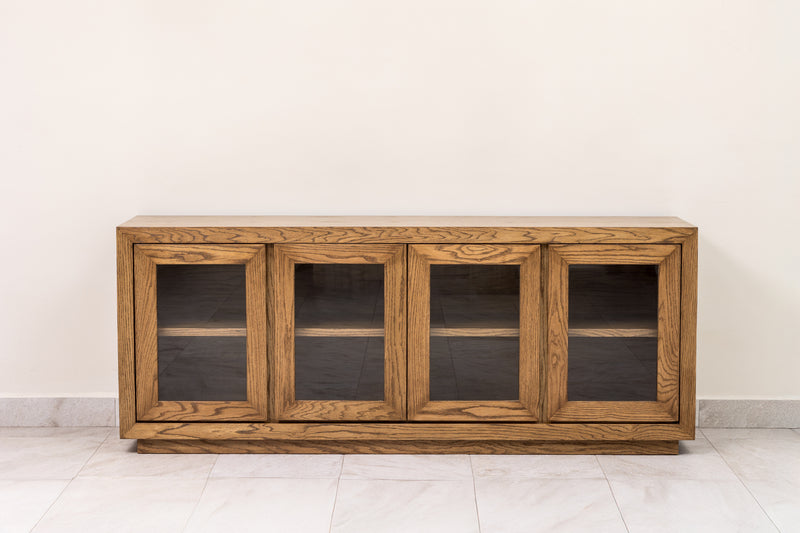 Oak wood sideboard credenza buffet cabinet with wood-framed glass doors and interior shelf, perfect for elegant dining room or living room storage.