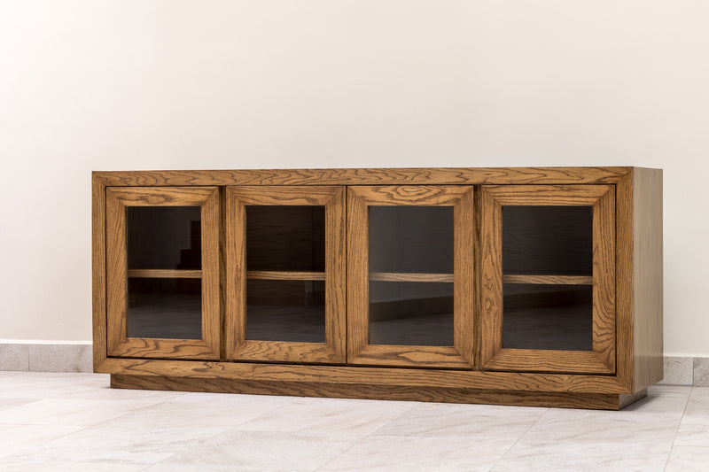 Oak wood sideboard credenza buffet cabinet with wood-framed glass doors and interior shelf, perfect for elegant dining room or living room storage.