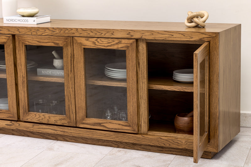 Oak wood sideboard credenza buffet cabinet with wood-framed glass doors and interior shelf, perfect for elegant dining room or living room storage.