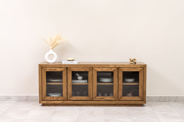 Oak wood sideboard credenza buffet cabinet with wood-framed glass doors and interior shelf, perfect for elegant dining room or living room storage.