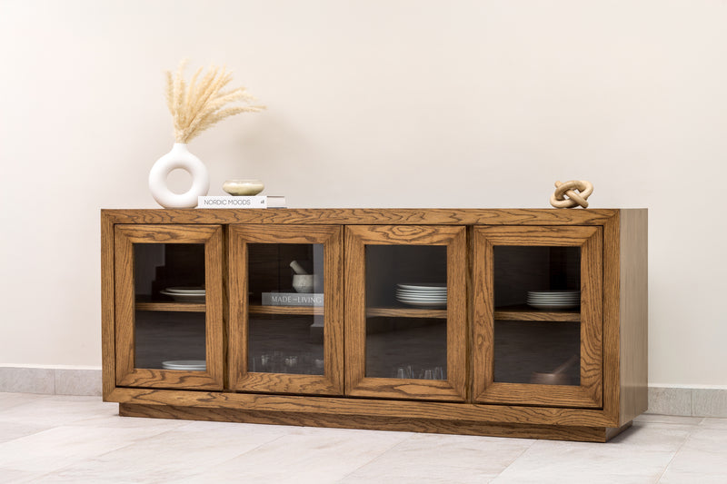 Oak wood sideboard credenza buffet cabinet with wood-framed glass doors and interior shelf, perfect for elegant dining room or living room storage.
