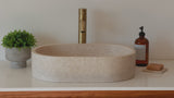 Oval marble vessel sink made from natural stone, modern countertop bathroom sink